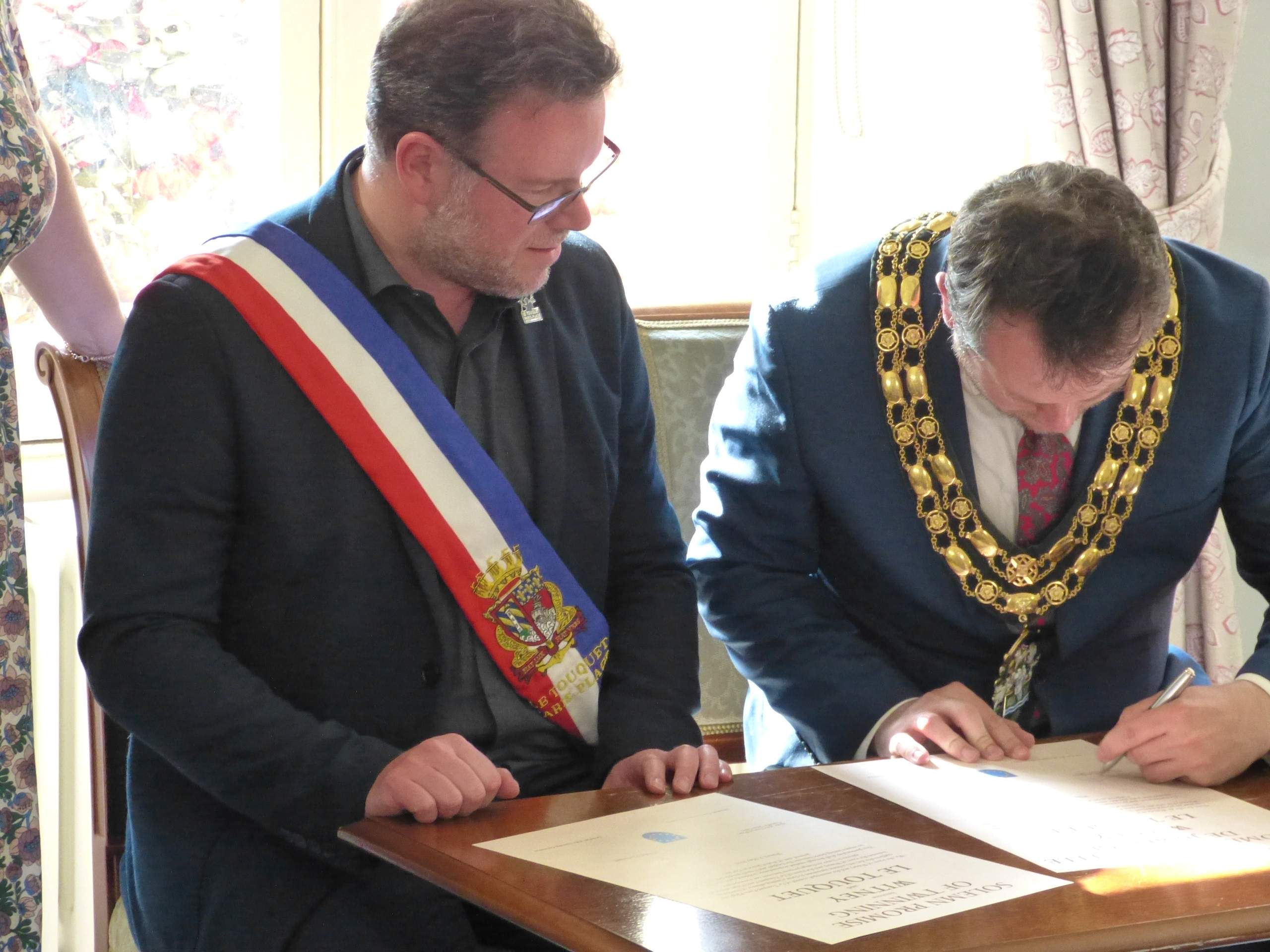Mayor signing documents